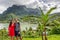 Bora Bora luxury cruise travel vacation tourists couple in front of Mt Otemanu in French Polynesia. Tahiti getaway