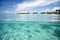 Bora Bora\\\'s Tropical Beauty: Split View of Clear Waters, White Sand Beach, and Overwater Bungalows