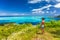 Bora Bora Tahiti cruise travel shore excursion tourist woman hiking on hike trail top view of lagoon and island, French