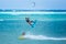 Boracay island, Philippines - January 25: two kiteboarders using rope tow while riding
