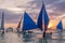 BORACAY, PHILIPPINES - FEBRUARY 1, 2018: Sunset behind Bangkas paraw , double-outrigger boats, Boracay island, Philippin