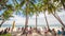 BORACAY, PHILIPPINES - JANUARY 7, 2018 - Tourists relaxing on the paradise shore of the White Beach in Boracay