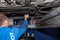 Bordeaux , Aquitaine / France - 03 15 2020 : peugeot man car mechanic repair lifted automobile at repair service station garage
