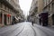 Bordeaux, France, October 18, 2011 : Vital Carles street with tramway rails and Saint Andre church in the background