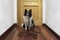 Border collie waiting at the door of the house