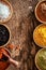 Border of colourful spice in bowls