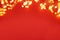 Border of defocused Christmas lights on red background. Christmas and New Year holidays celebration concept