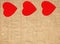 Border frame of red hearts on sack canvas burlap background