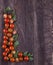 Border made from freshness sliced tomatoes on wood background. D