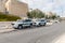 Border police cars are parked in the square near the Dung Gate, in front of the walls of the Temple Mount in the Old city of