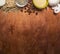 Border with walnuts, raisins, mushrooms couscous seasoning on wooden rustic background close up top view banner for website space