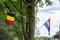 Borders inside European Union between Netherlands and Belgium, two flags on tree