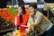 Bored couple with shopping trolley in organic section