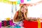 Bored gesture blond kid girl in party with puppy
