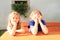 Bored kids behind wooden table