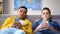 Bored multiracial male teens surfing social network replacing live communication