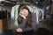 Bored Woman Leaning On Counter In Laundry