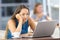 Bored woman watching on line content in a bar