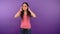 Bored Young Asian woman on isolated purple background closes her ears and does not listen 4K