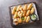 Borek sigara boregi fried pastry wrapped in cheese in phyllo closeup on the wooden board. Horizontal top view