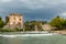 Borghetto Scaligeri Castle waterfalls and bridge on a heavy cloudy day in the village of Valeggio sul Mincio