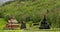 Borgund, Norway. People Walking Near Famous Norwegian Landmark Stavkirke An Old Wooden Triple Nave Stave Church In