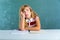 Boring sad expression student schoolgirl on desk