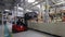 Borisov, Belarus - OCTOBER 29, 2021: a forklift delivers spare parts to an assembly line, a modern automotive plant