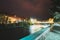 Borjomi, Georgia. Night View Of Bridge Of Beauty Over Kura River Passing Through City. Evening Night Illumination