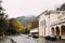 Borjomi, Samtskhe-Javakheti, Georgia. Cars Parked Near Borjomi Parki Railway Station Building In Autumn Day