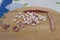 Borlotti beans peeled on wooden cutting board.