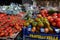 Borough Market, in Southwark, east London UK. Variety of tomatoes for sale in the foreground.