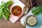 The borsch and mushroom soup served on table