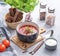 Borsch soup with beetroot, meat and sour cream in a bowl on a light background with croutons and fresh herbs