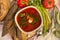 Borsch with sour cream and herbs, bread, vegetables, greens, food, top view