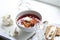 Borsch submitted with sour cream and garlic and a vodka wine-gla