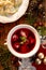 Borscht, beetroot soup with small dumplings with mushroom stuffing in a ceramic bowl. Traditional Christmas eve dish in Poland.