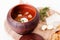 Borscht soup pot with sour cream and dill top wooden board beet white background