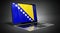 Bosnia and Herzegovina - country flag and binary code on laptop screen