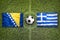 Bosnia and Herzegovina vs. Greece flags on soccer field