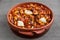 Bosnian food: tetovac baked beans with onion close-up in baking dish