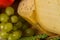 Bosnian traditional cheese served on a wooden container with peppers, parade and onions isolated on a white background