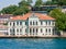 Bosporus strait coast, old wooden green villa with many windows.  Photo taken from cruise ship