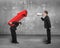 Boss using megaphone shouting at employee carrying red arrow sign