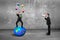 Boss using speaker yelling businessman balancing on sphere juggling balls