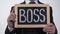 Boss written on blackboard in businessman hands, corporation top manager, leader