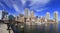 Boston skyline with skyscrapers reflections into the ocean and waterfront promenade on the foreground