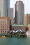 Boston skyscrapers above old fishing shacks