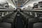 Boston, USA - October 22, 2021: Empty interior of Amtrak train with rows of seats. Inside of a dark train during pandemic