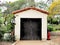 Botanic garden storage shed with Spanish tile roof in Santa Barbara, California.